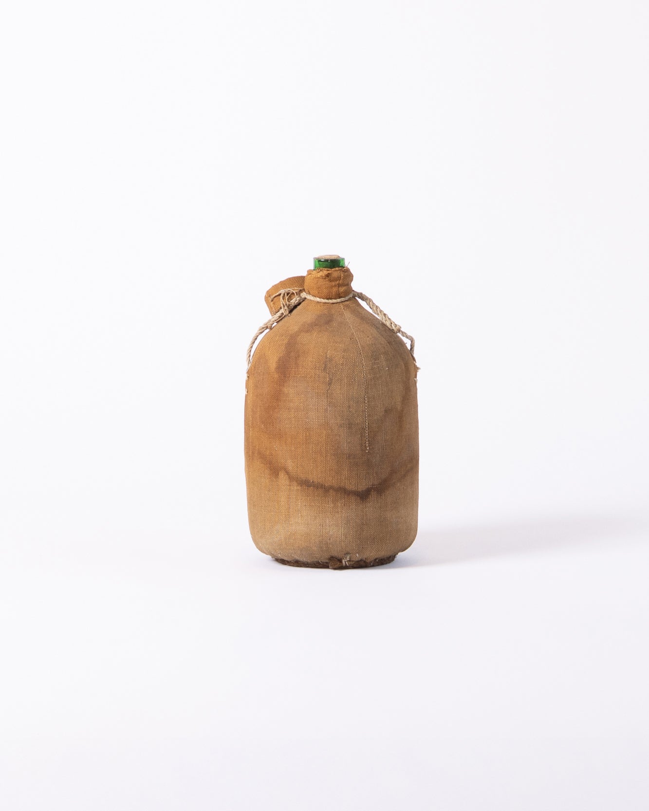 Burlap-covered glass bottle