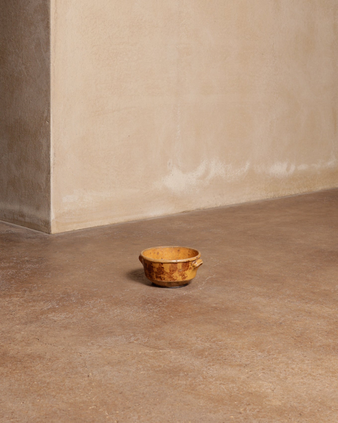 Glazed earthenware pot with side handle<br>Nicolas Trembley