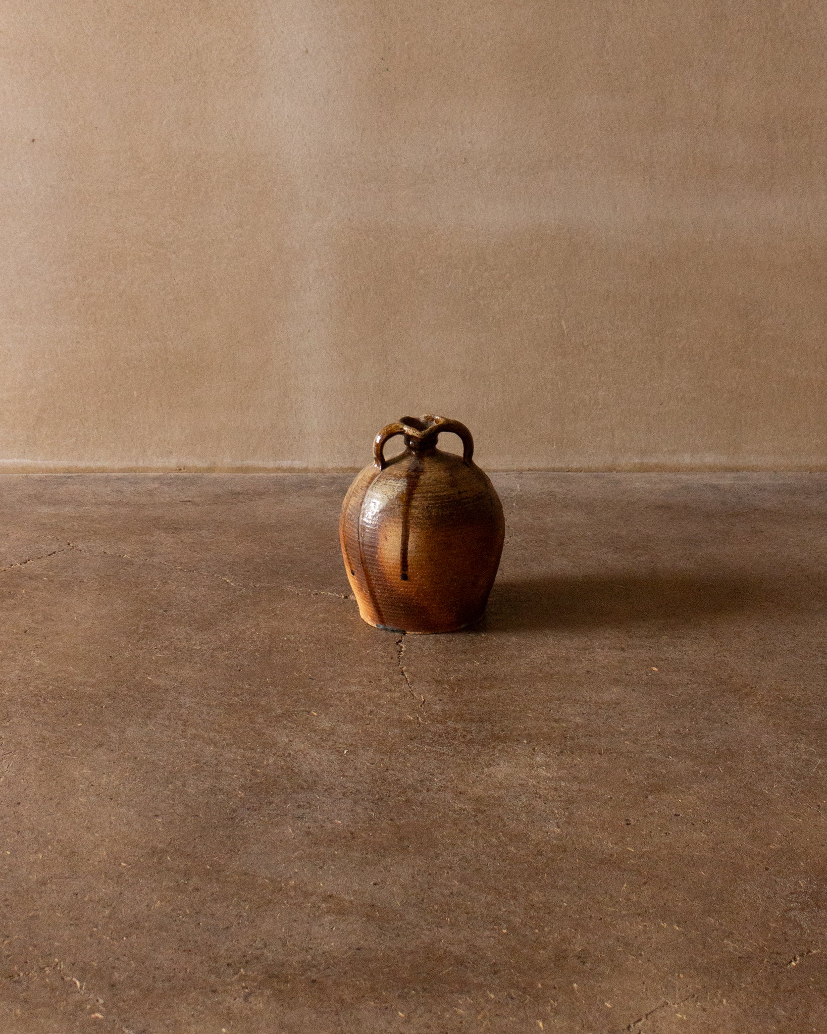 Two-handled stoneware jug