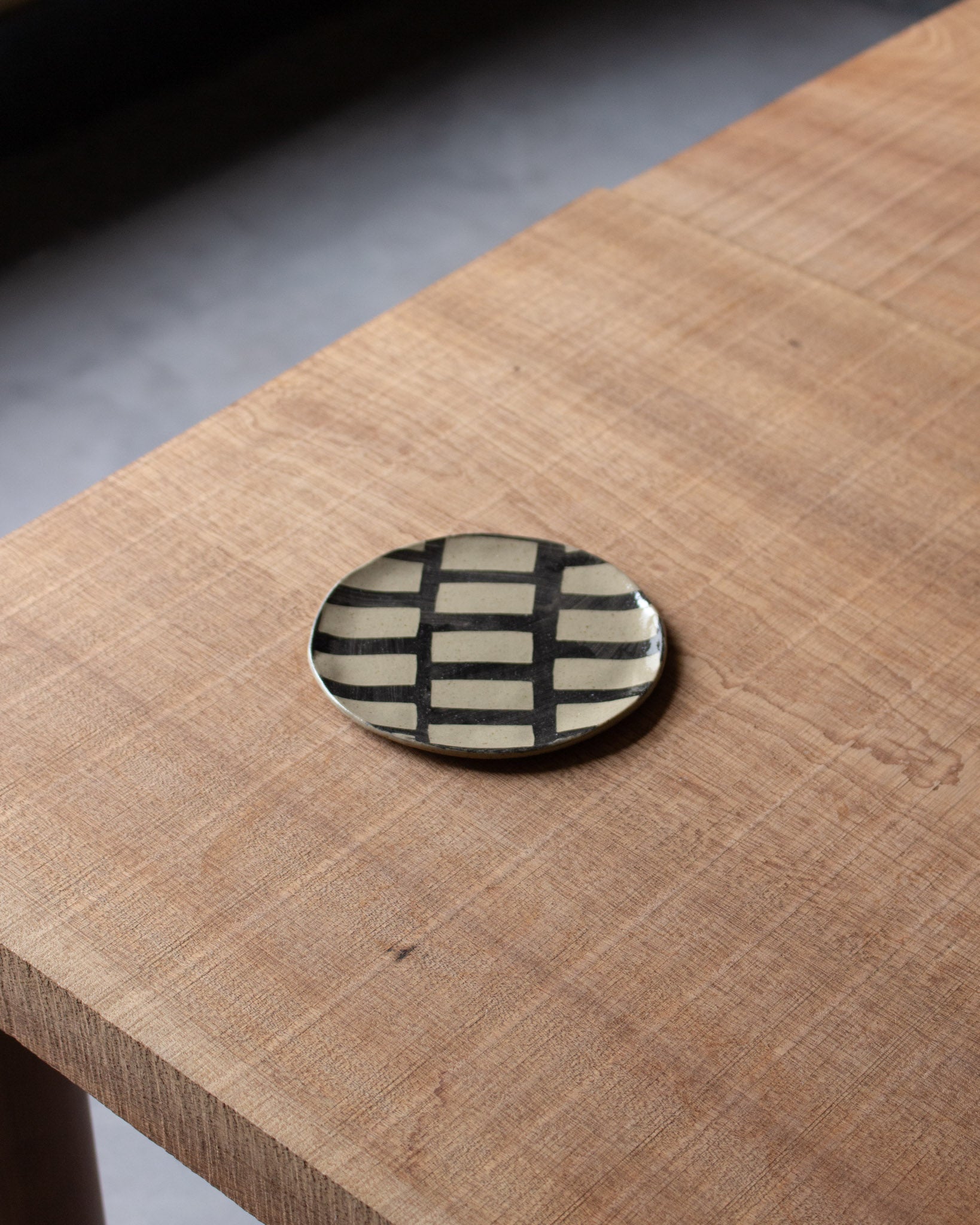 HAAR black inlaid stoneware small plate<br>Lydia