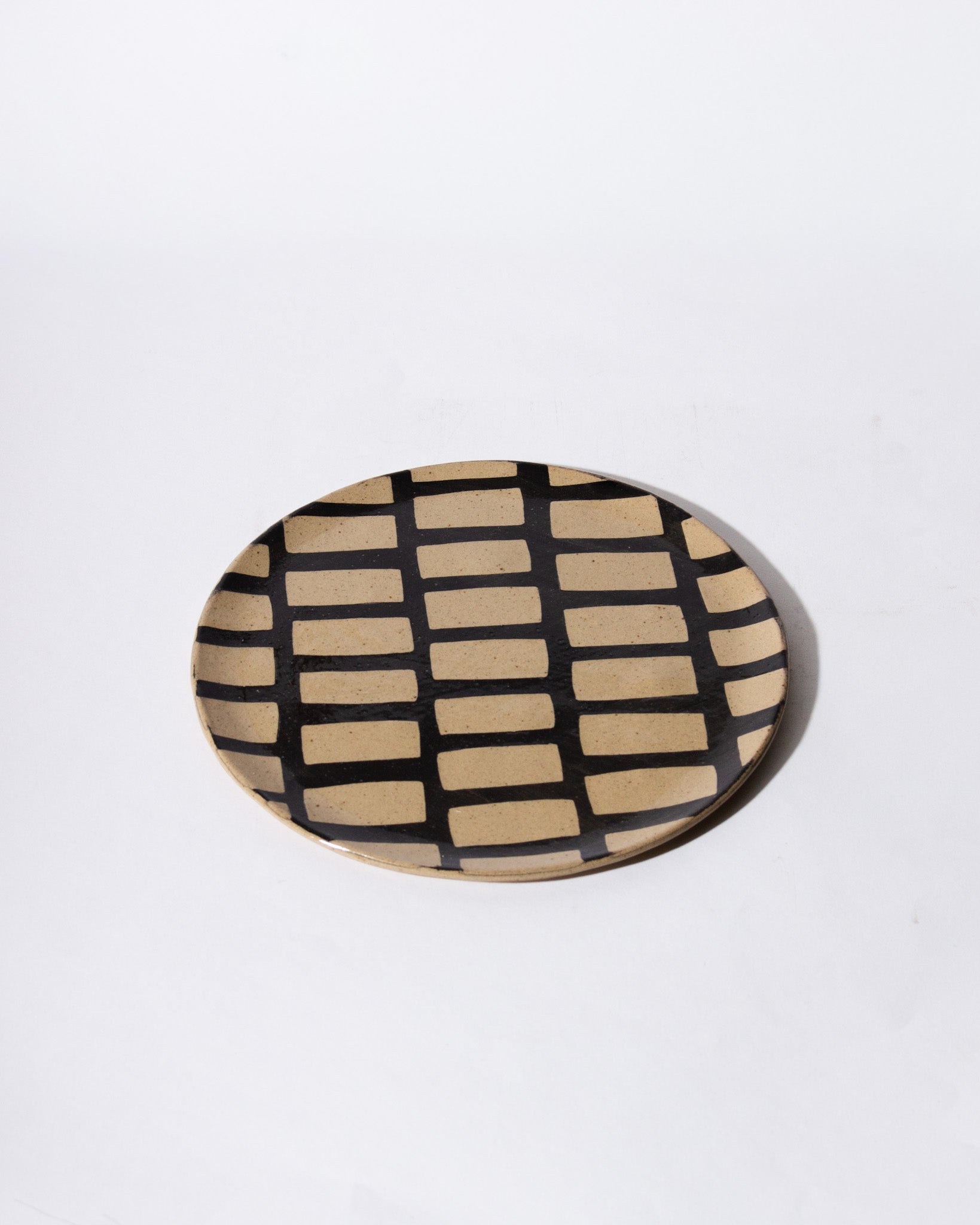 HAAR black inlaid stoneware plate<br>Lydia